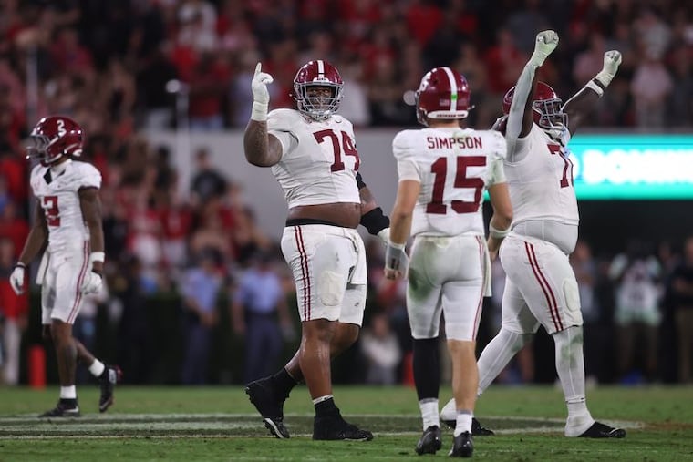 Alabama offensive lineman Kadyn Proctor (74) helped protect quarterback Ty Simpson (15) as a member of the Crimson Tide last season.