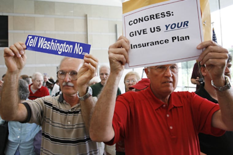 Jim Dougherty (left) and Russ Consentino display their feelings after the meeting at the National Constitution Center. (Michael S. Wirtz / Staff Photographer)