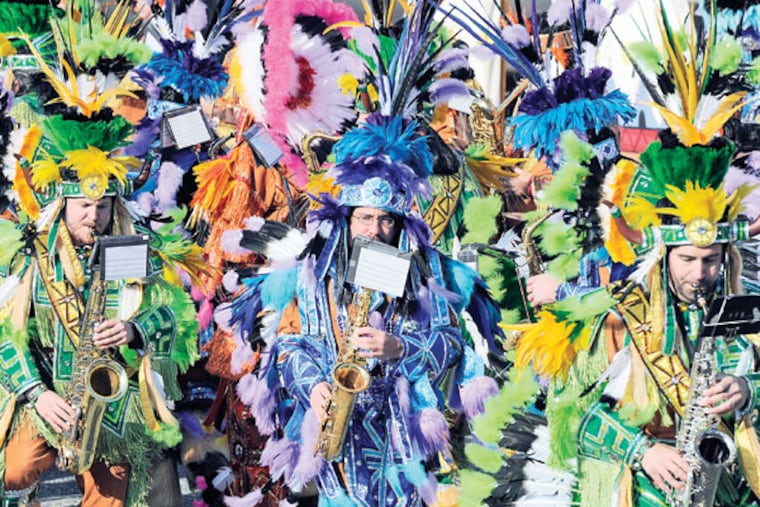 The Woodland String Band holds its first full dress rehearsal of the season outside their warehouse on Oregon Avenue on Dec. 21, 2014. ( TOM GRALISH / Staff Photographer )