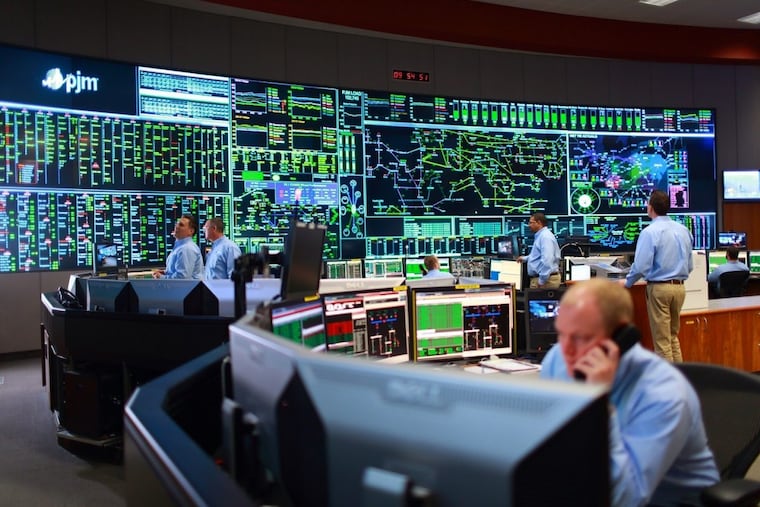 Operators manage the regional power grid from PJM Interconnection’s control room in Valley Forge.