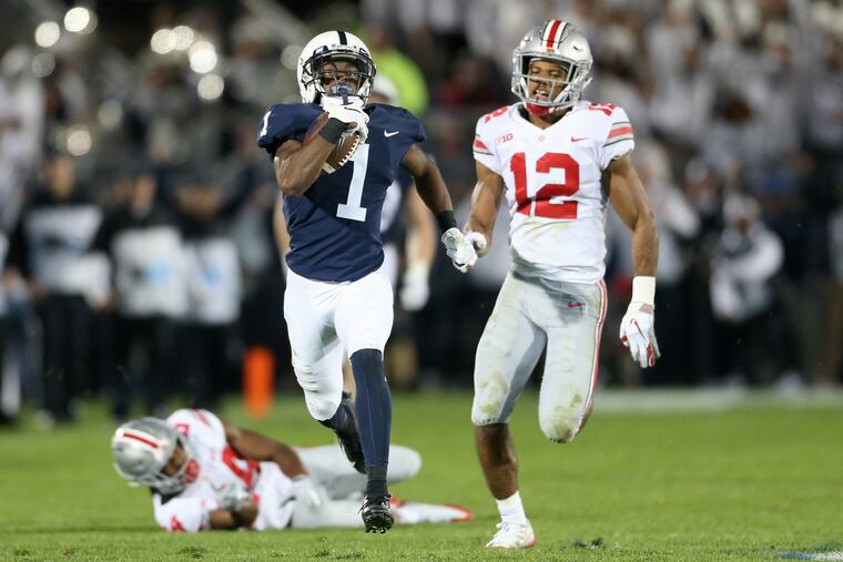 Penn State wide receiver KJ Hamler (1) outruns Ohio State cornerback Sevyn Banks (12) for a touchdown on Saturday.