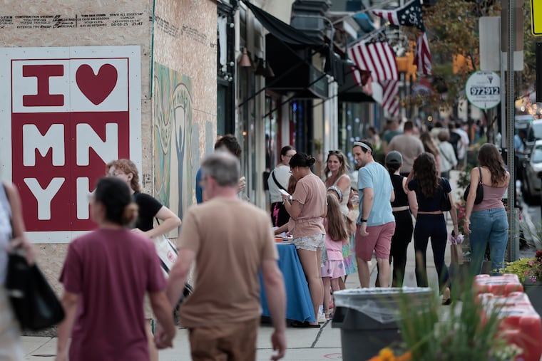 Folks out and about during the Stroll After Hours in Manayunk at the end of July.