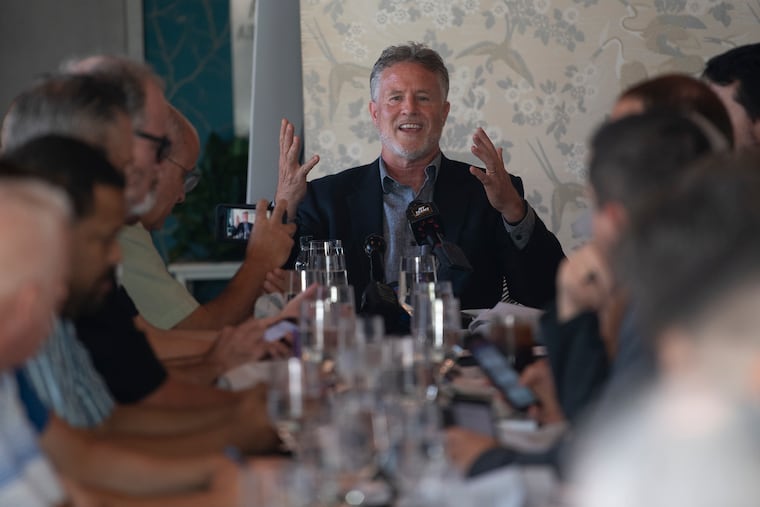 Brett Brown, 76ers head coach, talks to members of the media at lunch.