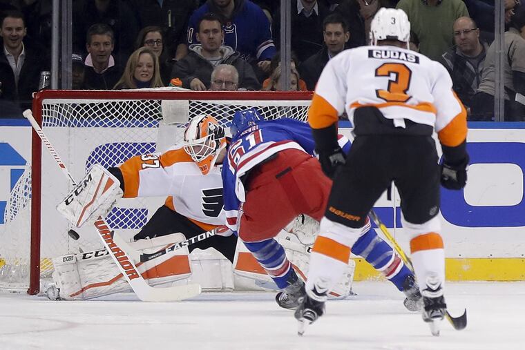 New York Rangers right wing Rick Nash (61) scores a goal against Philadelphia Flyers goaltender Brian Elliott (37) during the first period of an NHL hockey game, Tuesday, Jan. 16, 2018, in New York.