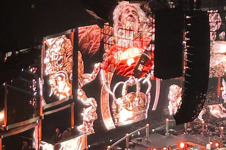 Brian May dons a Phillies jersey while playing 'We are the Champions' at the Wells Fargo Center on Wednesday.