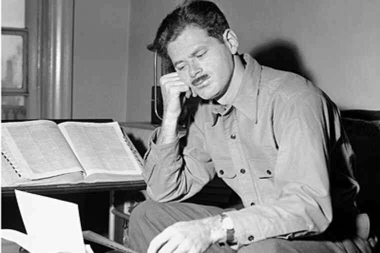 In this April 24, 1944 file photo, radio show writer Norman Corwin ponders over a script for one of his Tuesday night broadcasts, in New York. (AP File Photo)