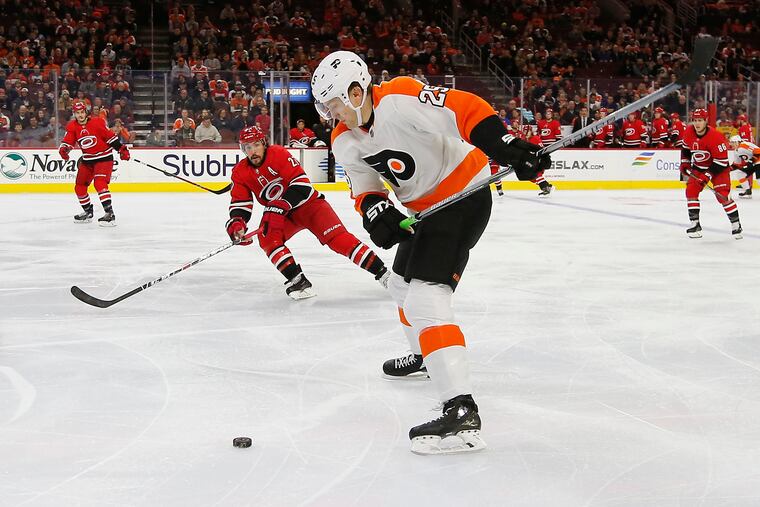 Flyers left winger James van Riemsdyk, shown shooting the puck against Carolina, will go back to the top line Thursday against visiting Dallas. In Tuesday's 5-3 loss in Washington, he played most of the game on the fourth unit.