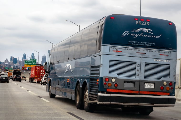 A Greyhound bus travels south on Interstate I-95 toward Center City Philadelphia.