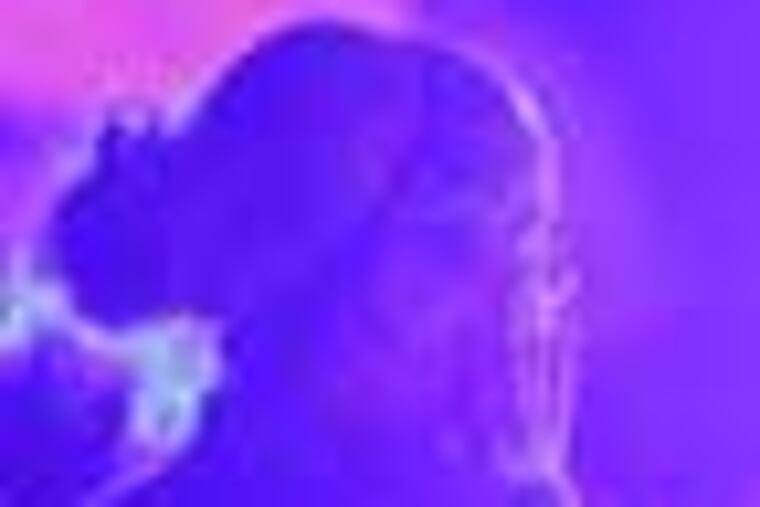 Medics transport an 18 year-old man, suffering from a gunshot wound to the head, from the 1900 block of East Cumberland Street, in the Kensington section of Philadelphia, Wednesday June 6, 2012. The shooting occurred in the first floor apartment where a 9 mm semi-automatic handgun was located and one projectile, police said. Both a 13 year-old boy and a 22 year-old man were present during the incident and were taken in for questioning, but police said the circumstances of the shooting were unclear at this time. The shooting victim was in very critical condition at Temple University Hospital, police said. (For the Daily News/ Joseph Kaczmarek)