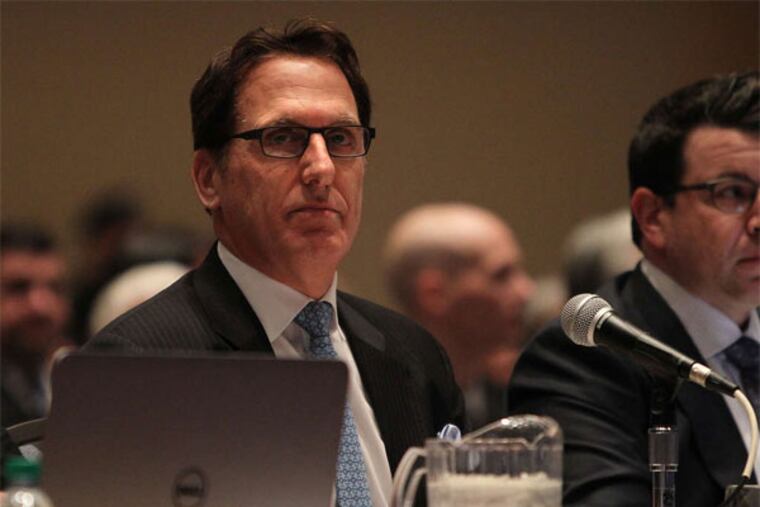 Developer Bart Blatstein watches a video during the start of Gaming Control Board hearings on a second Philadelphia casino. (David Maialetti / Staff Photographer)