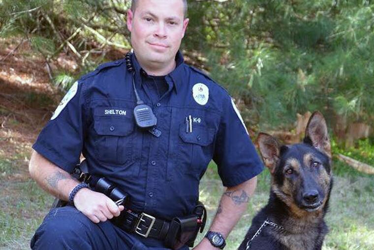 Rousey, who was picked up in York County last summer, with Rocky Mount (Va.) Officer Chris Shelton. Dogs in law enforcement cost thousands of dollars if they are purchased from elite breeders.
