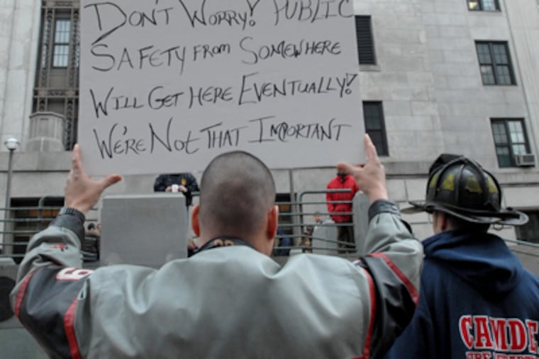 A protest last month at Camden City Hall over cuts. (April Saul/Staff)