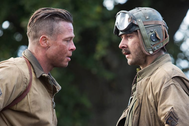 This photo released by Sony Pictures Entertainment shows, Brad Pitt, left, as Wardaddy, and Shia LaBeouf as Boyd "Bible" Swan, in a scene from Columbia Pictures' "Fury." (AP Photo/Sony Pictures Entertainment, Giles Keyte)