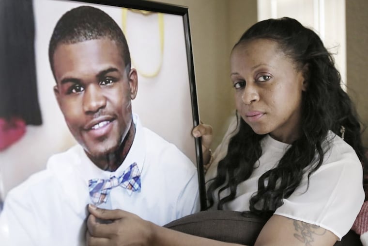 Felicia Pendleton with a photo of her son, Jayvon Faheem Mitchell Pendleton. Photo is from prom when he was 18 yrs old. Jayvon was 20 when he was shot and killed on March 2, 2016.