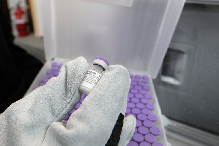 At Skippack Pharmacy in Skippack, Pa., pharmacist Mayank Amin with vaccine doses.