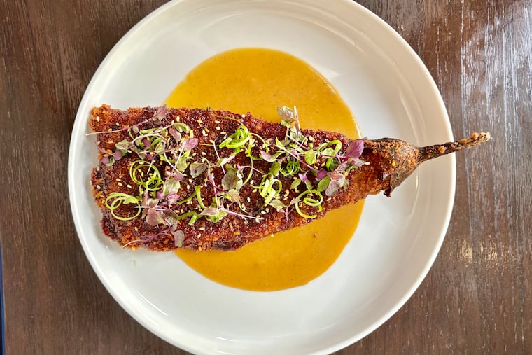 The eggplant katsu at Vernick Fish comes over a Japanese curry sauce topped with furikake seasoning and micro-herbs.