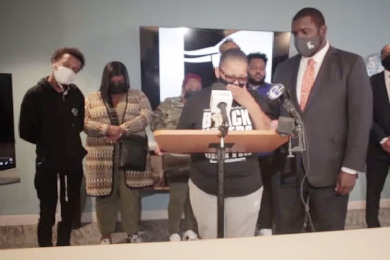 Rachel Briggs speaks at a news conference Sept. 1 announcing a federal civil rights lawsuit against Chester Township police. Briggs' attorney, Kevin Mincey (right), says the officers arrested Briggs and six other residents using an unconstitutional loitering statute.