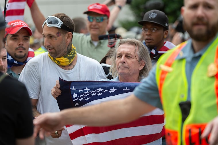 White nationalists march to Lafayette Square during the "Unite the Right 2" rally in Washington, Sunday, Aug. 12, 2018.