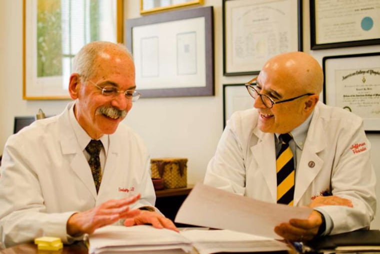 Howard Weitz (left) and Geno Merli joke during work at Thomas Jefferson University Hospital. They film an innovative medical education show called "The Consult Guys."