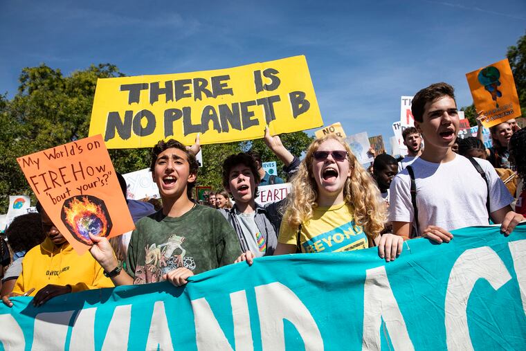 Activists gather in John Marshall Park for the Global Climate Strike protests on Sept. 20, 2019 in Washington, United States. President Trump on Monday removed a top official who has led government research on climate change.