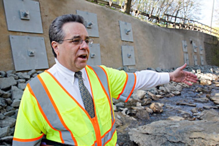 Engineer David Perri said that if a retaining wall had collapsed, it would have taken Lincoln Drive, too. AKIRA SUWA / Staff Photographer