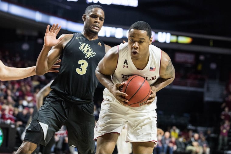 Freshman forward J.P. Moorman II keeps the ball away from UCF redshirt-senior guard-forward A.J. Davis before making a pass during the second half of Temple's 75-56 win over UCF at The Liacouras Center on Sunday, February 25, 2018.
