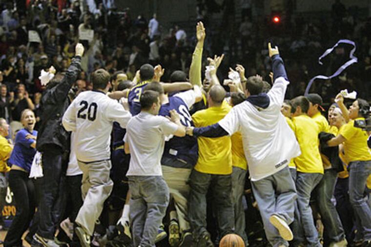 LaSalle Fans swarm the crowd after their upset of St. Joe's at the Palestra on Feb. 18, 2008. (Ron Cortes / Staff Photographer)