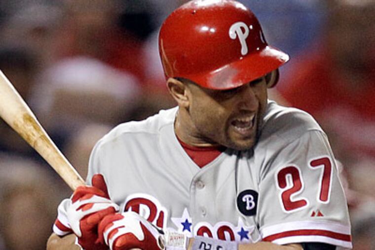 Placido Polanco missed Sunday's game with what manager Charlie Manuel described as "aches and pains." (Jeff Roberson/AP)