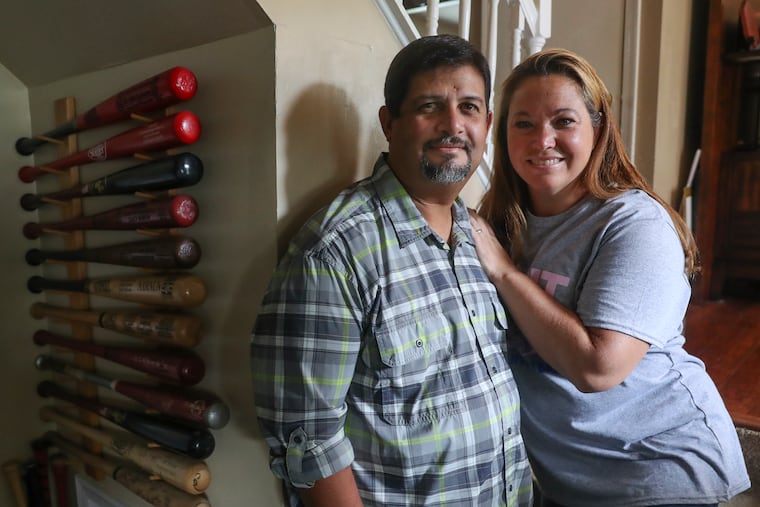 Juan and Lena Namnun pose for a portrait inside their home in Delran. The Namnuns won World Series tickets from 'Good Morning America.'