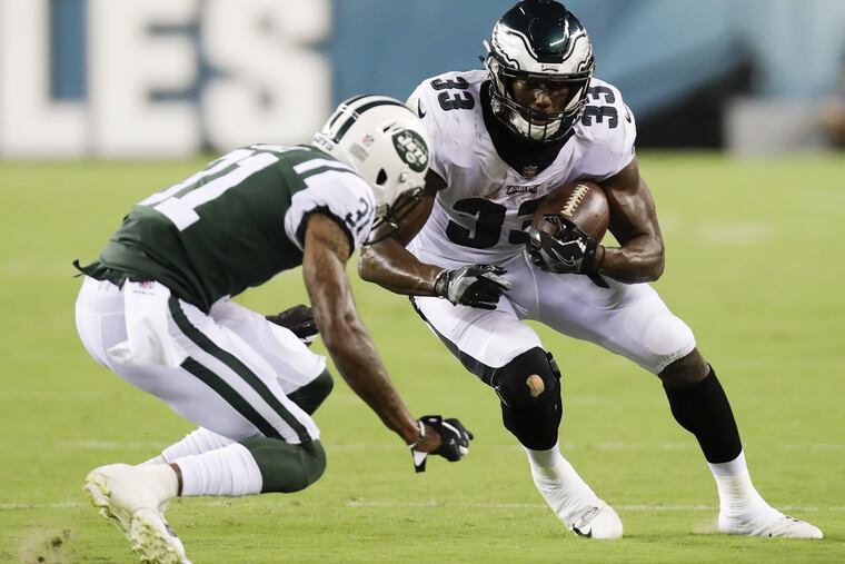 Eagles running back Josh Adams runs with football against New York Jets cornerback Derrick Jones during a preseason game on Thursday, August 30, 2018. YONG KIM / Staff Photographer