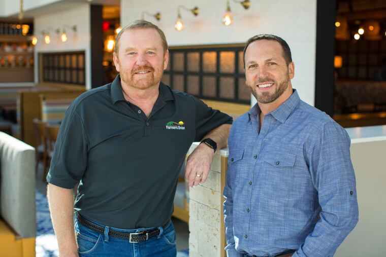 Mark Watne (left) and Dan Simons run Founding Farmers in King of Prussia.
