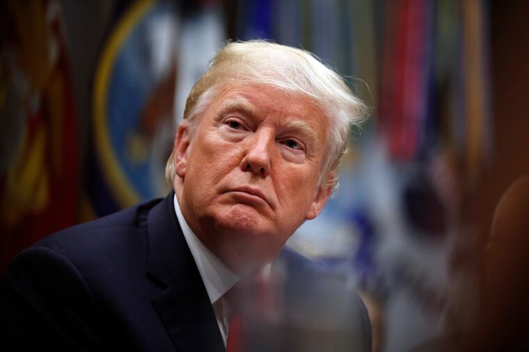 President Trump listens during a discussion for drug-free communities support programs, in the Roosevelt Room of the White House.
