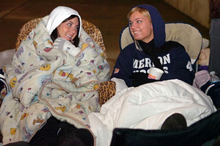 Katie Quinn (left), 19, and friend Melinda Affrol, 20, camped out all night with hundreds to meet 'Twilight' star Robert Pattinson at the King of Prussia Mall. (Sarah J. Glover / Staff Photographer)
