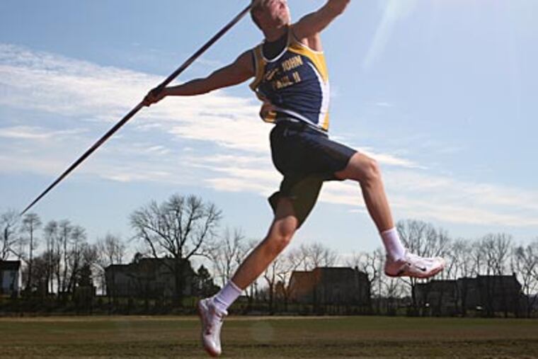 Pope John Paul II javelin thrower Tom Lang works out during practice. (Michael Bryant/Staff Photographer)