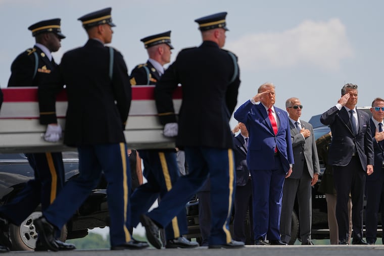 President Donald Trump and Secretary of Defense Pete Hegseth, salute as a U.S. Army carry team moves a transfer case containing the remains of Pvt. Isabella Gonzales of Carrollton, Texas, Wednesday, July 22, 2026, at Dover Air Force Base, Del.