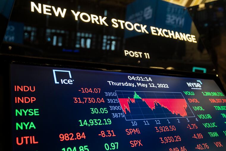 Screens display end-of-day trading results at the New York Stock Exchange on May 12, 2022, in New York. A long-standing rule of thumb holds that a recession occurs when the economy shrinks for two consecutive quarters.