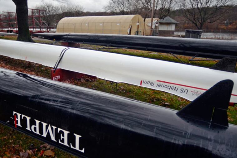 Temple University Crew team boats are stored outside, near their
temporary tents along the Schuylkill River December 6, 2013. In a
stunning move, Temple killed seven of its 24 intercollegiate sports
programs including rowing. The decision to eliminate men and women's
rowing is in large part due to lack of a proper facility. Temple had
shared a canoe club that was condemned, and since that time, its
program has operated out of these tents and the school has been
unsuccessful in securing land and funding for a new boathouse. (Tom Gralish/Staff Photographer)