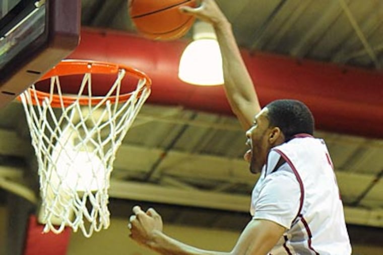 St. Joseph's C.J. Aiken overcame cancer as a child to become the nation's leading shot blocker. (Clem Murray/Staff Photographer)