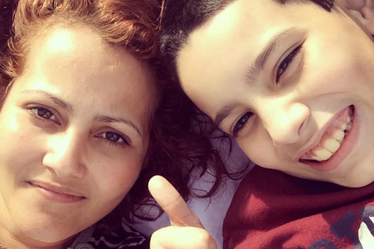 Sharon Romero and her son, Joshua, 11. As a result of a lawsuit filed on behalf of Joshua and other children with autism, the Philadelphia School District must now give parents a say in where their children are educated. (Family photo)