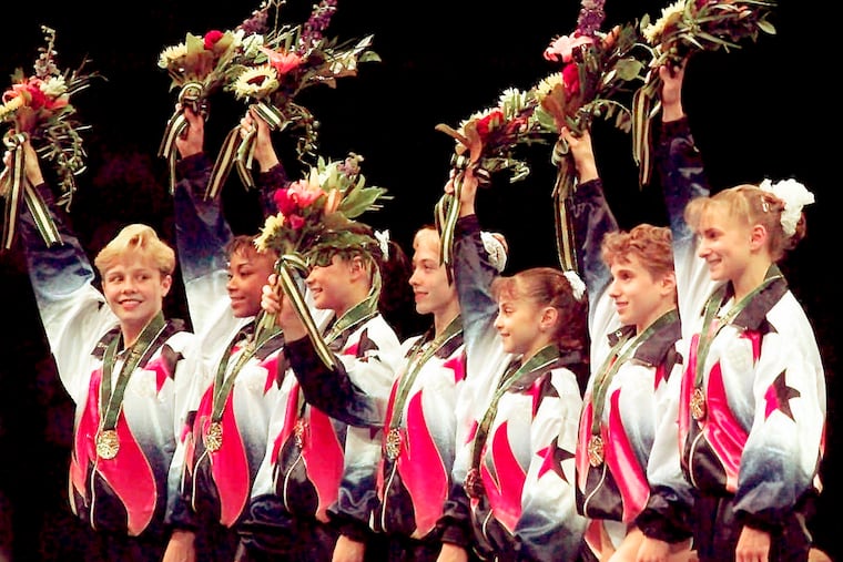 Dominique Dawes (second from left) was part of the "Magnificent Seven" at the 1996 Olympics and has since built a chain of gymnastics academies.