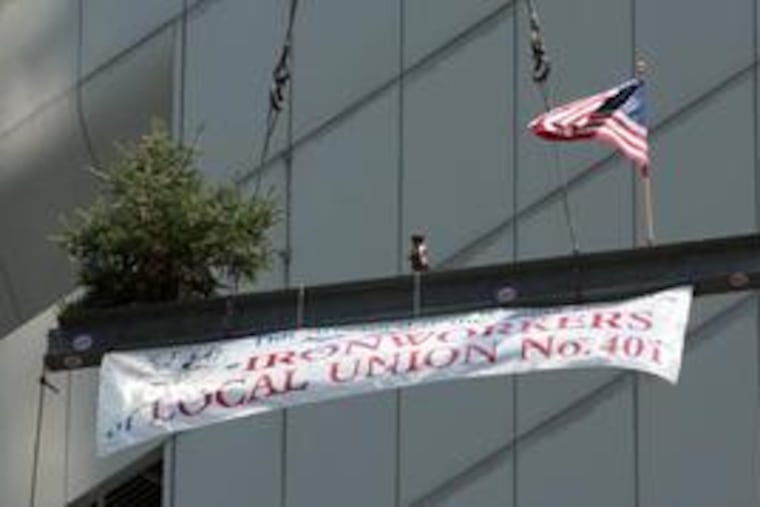 Can Phils win it for the little guy? A William Penn statuette attached to the final girder lifted to the Comcast Center went missing but was replaced.