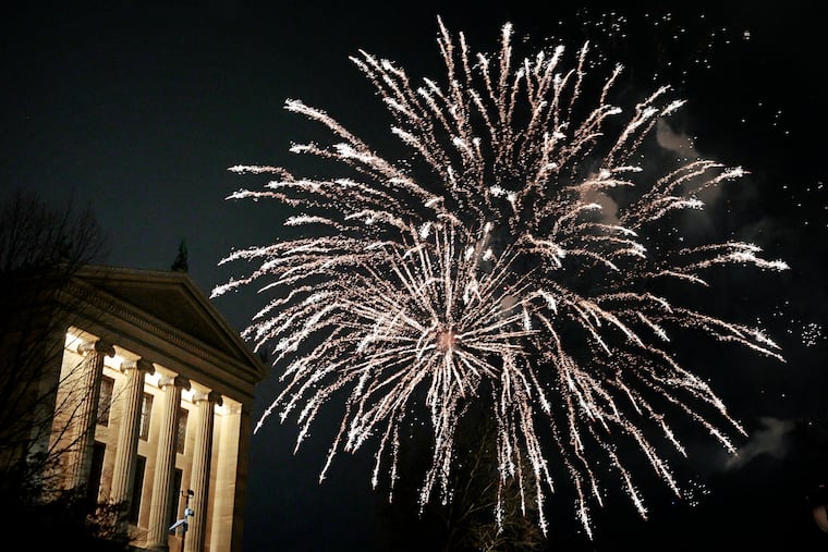 Fireworks rise, shortly after midnight, from behind the Art Museum during the New Year’s Eve concert and fireworks display, at the Oval on the Benjamin Franklin Parkway, on Thursday, Jan. 1, 2026. The event, featuring LL COOL J, DJ Jazzy Jeff, Adam Blackstone, hard rockers Dorothy, and Technician The DJ was a first for the City of Philadelphia and Mayor Cherelle L. Parker.