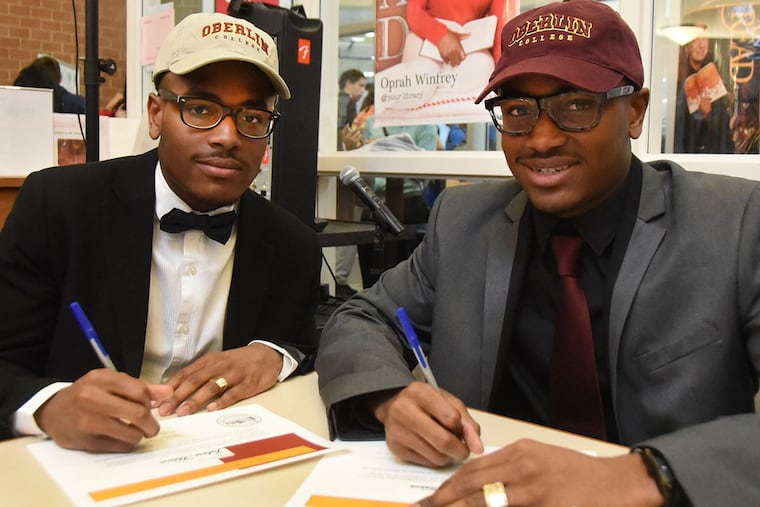 Jubree Hason (left) and his twin Jubreel after a signing ceremony at Timber Creek on Wednesday.