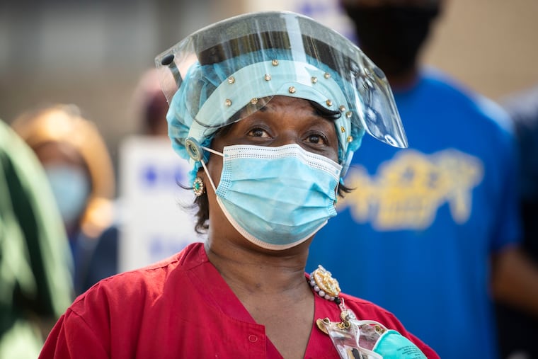 Longtime Temple University Health System employee Margo Crawford spoke as healthcare workers and other hospital employees gathered for a news conference hosted by the National Union of Hospital and Health Care Employees (1199C) outside of Temple University Hospital in Philadelphia on Tuesday. The union, which represents two thousand workers between Temple Hospital and Temple University, is demanding hazard pay for working through the coronavirus pandemic.