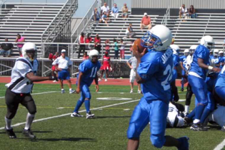 Bok's Gary Jackson catches a pass during its game against Southern. Bok won, 36-0. (Photo by Ted Silary)