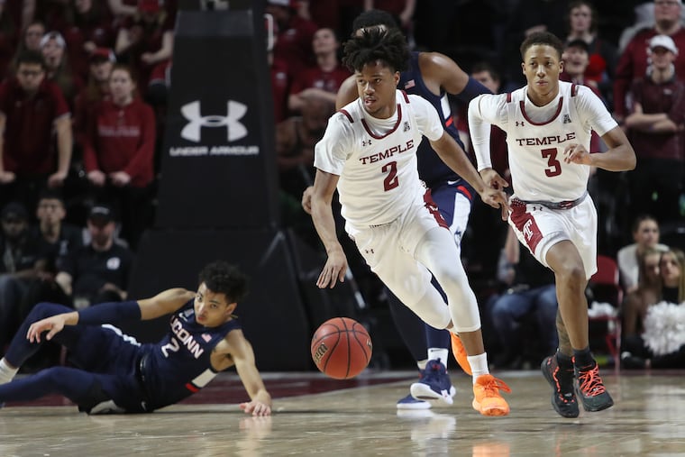 Temple's Monty Scott (2) heads down court making a steal against Connecticut.