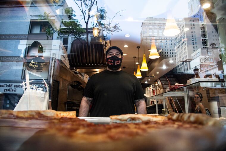 Giuliano Tomasi is photograph at Joe's Pizza on 122 S 16th St. Philadelphia, Pa. Monday June 1, 2020. The restaurant was one of the family business that survived the looting.