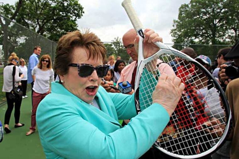 Tennis great Billie Jean King plays some air guitar on a tennis racket as the Rocky theme plays over the sound system. A year ago, King helped dedicate the $550,000 refurbishing of the Hunting Park Tennis Courts. ( CHARLES FOX / Staff Photographer )