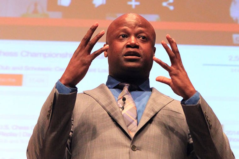 Maurice Ashley, the first African-American chess grand master, spoke to 150 young Philadelphia chess players in the National Constitution Center's Kirby Auditorium and then answered questions and cast volunteers in various chess situations on Friday, June 6, 2014. ( CHARLES FOX / Staff Photographer )