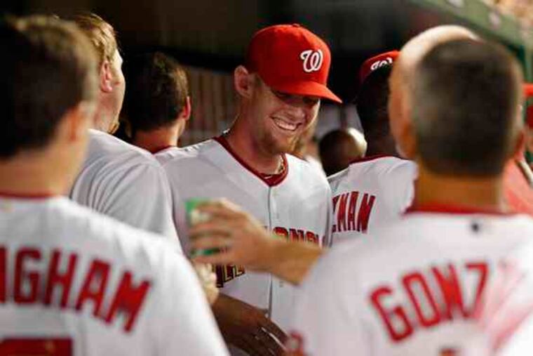 Stephen Strasburg is congratulated after striking out 14 in debut.